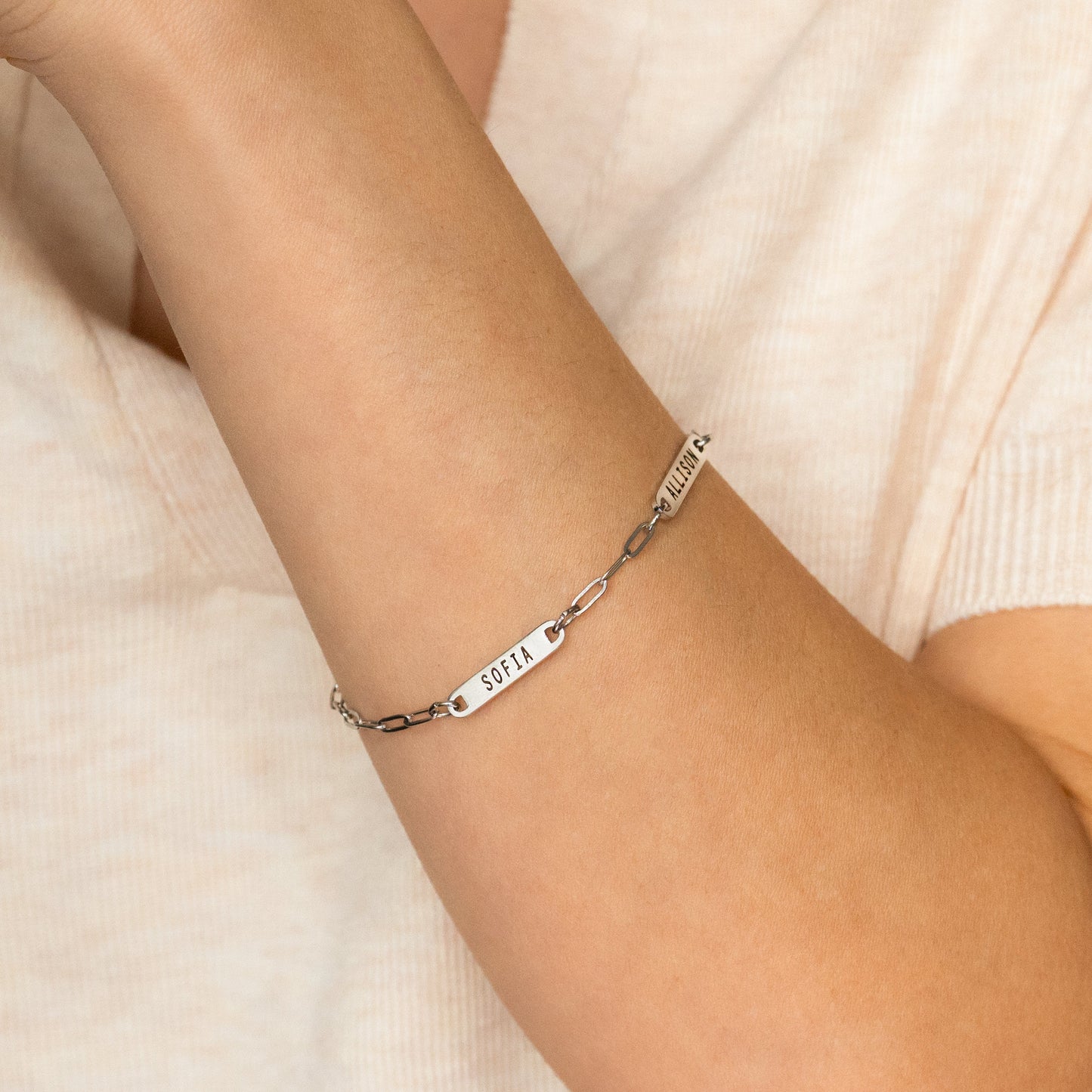 Personalized Paperclip Name Bracelet in 925 sterling silver, worn on a model
