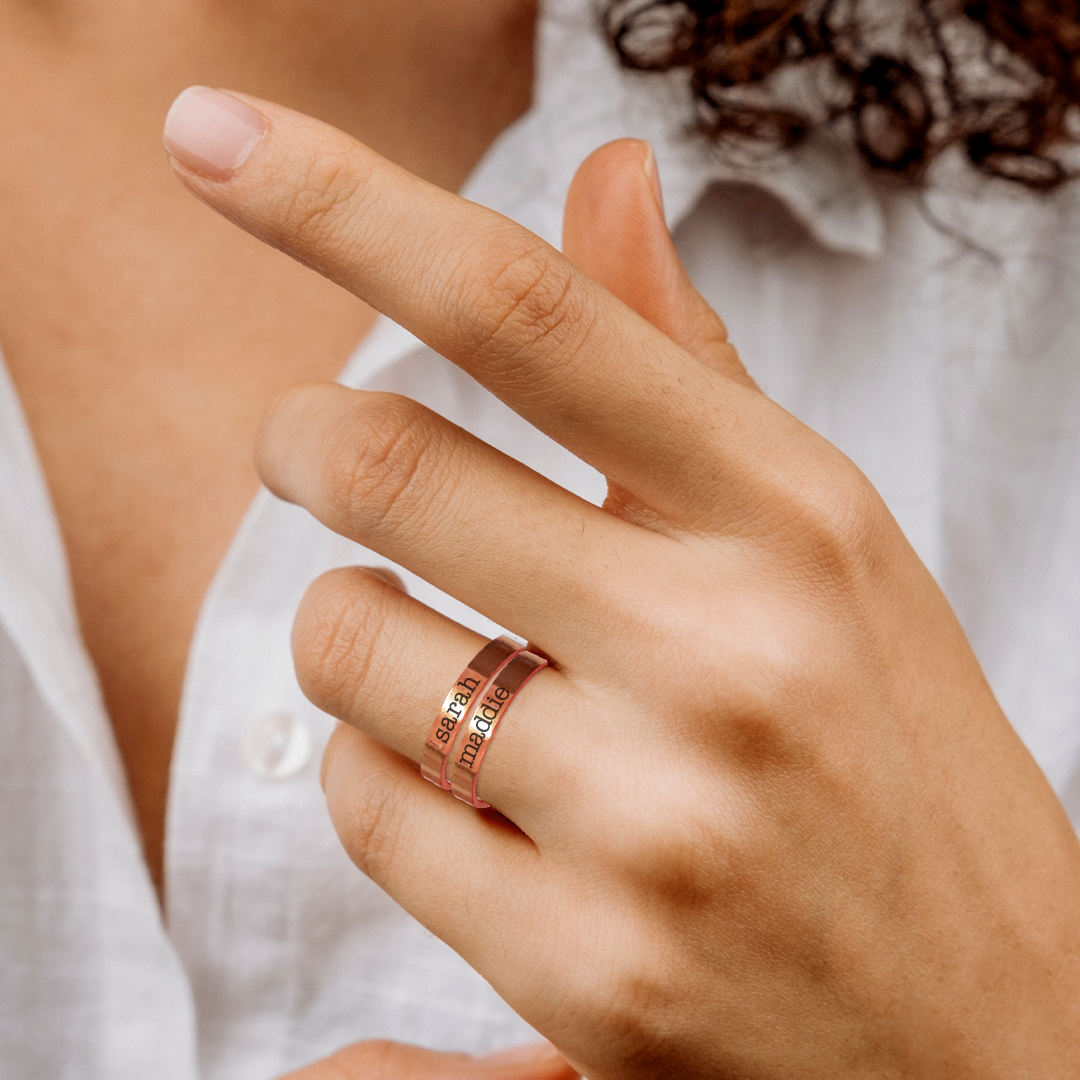 Engraved Stackable Name Ring | 3mm Band in rose gold tone, worn on a model