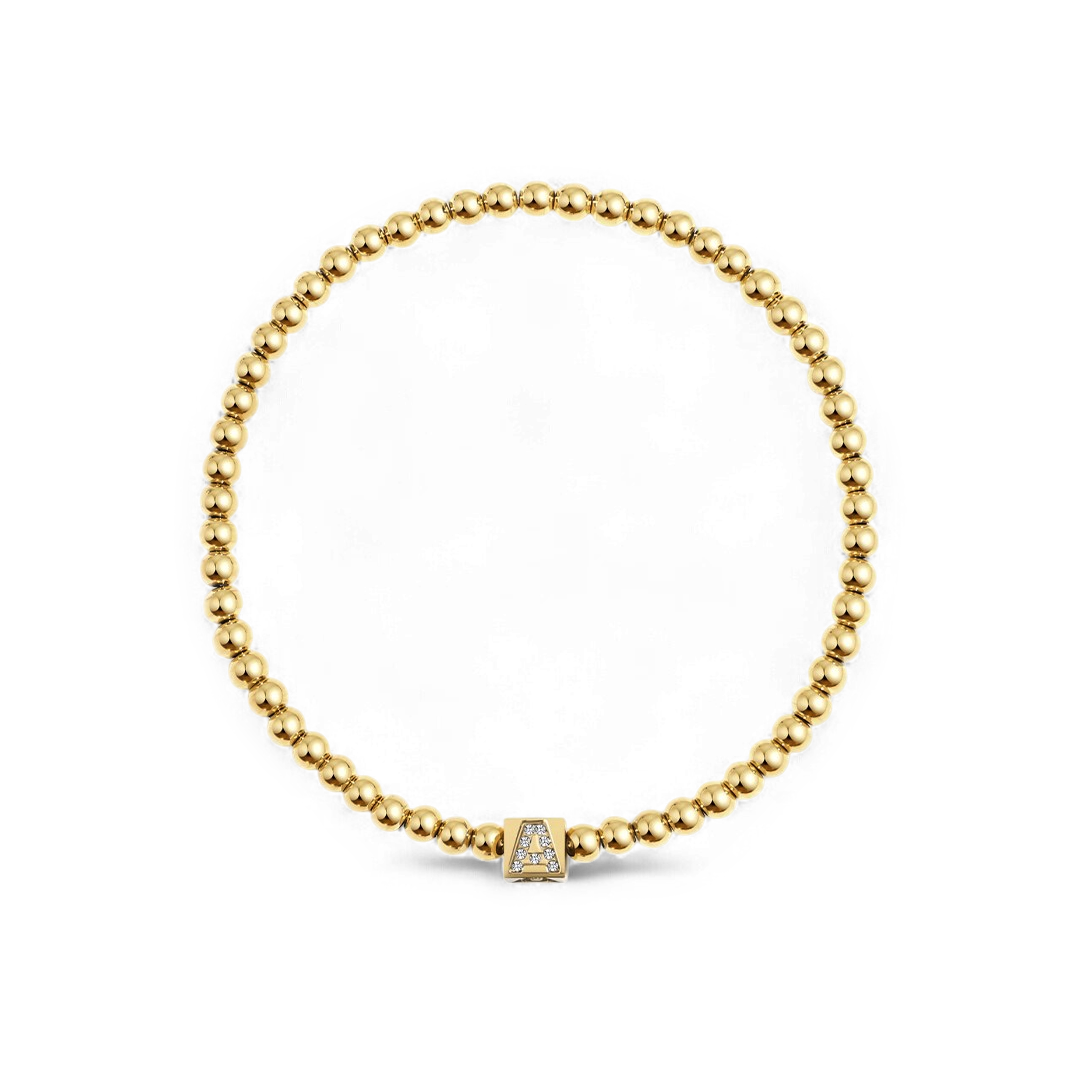 Bracciale con iniziale a blocchi e perline dorate