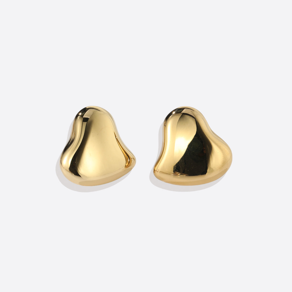 Polished Sculptural Heart Earrings in gold tone