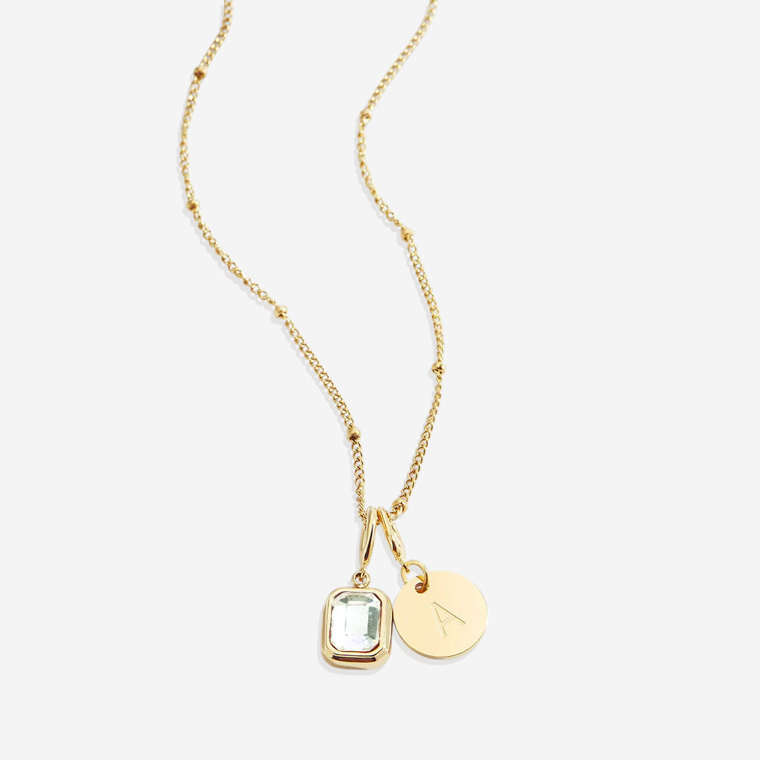 Collana con baguette, pietra portafortuna e iniziale