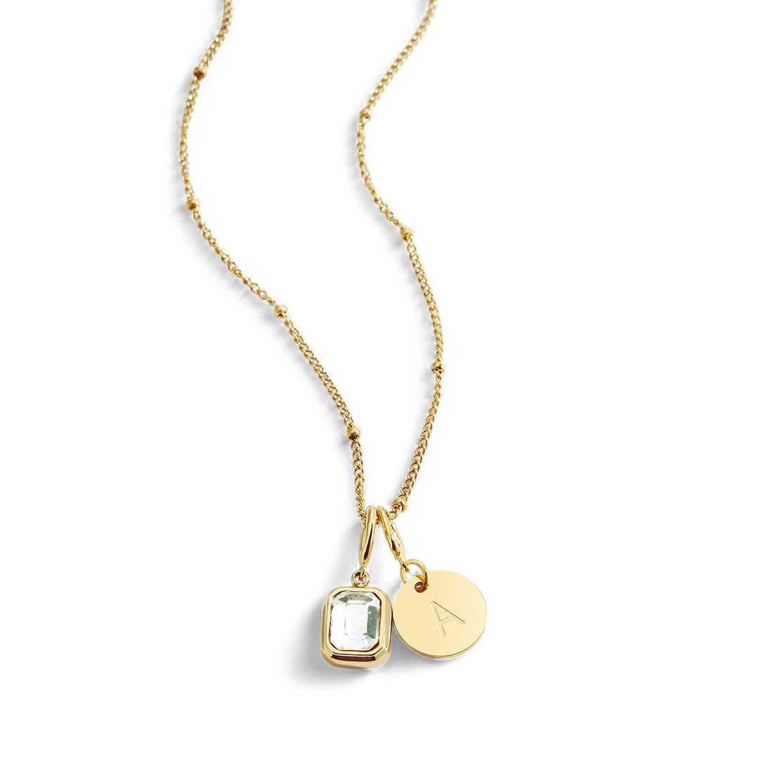 Collana con baguette, pietra portafortuna e iniziale