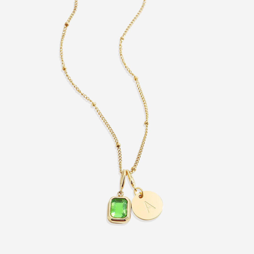 Collana con baguette, pietra portafortuna e iniziale