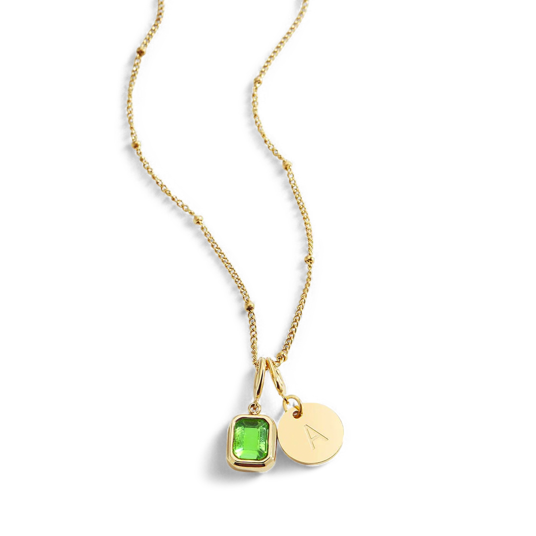 Collana con baguette, pietra portafortuna e iniziale