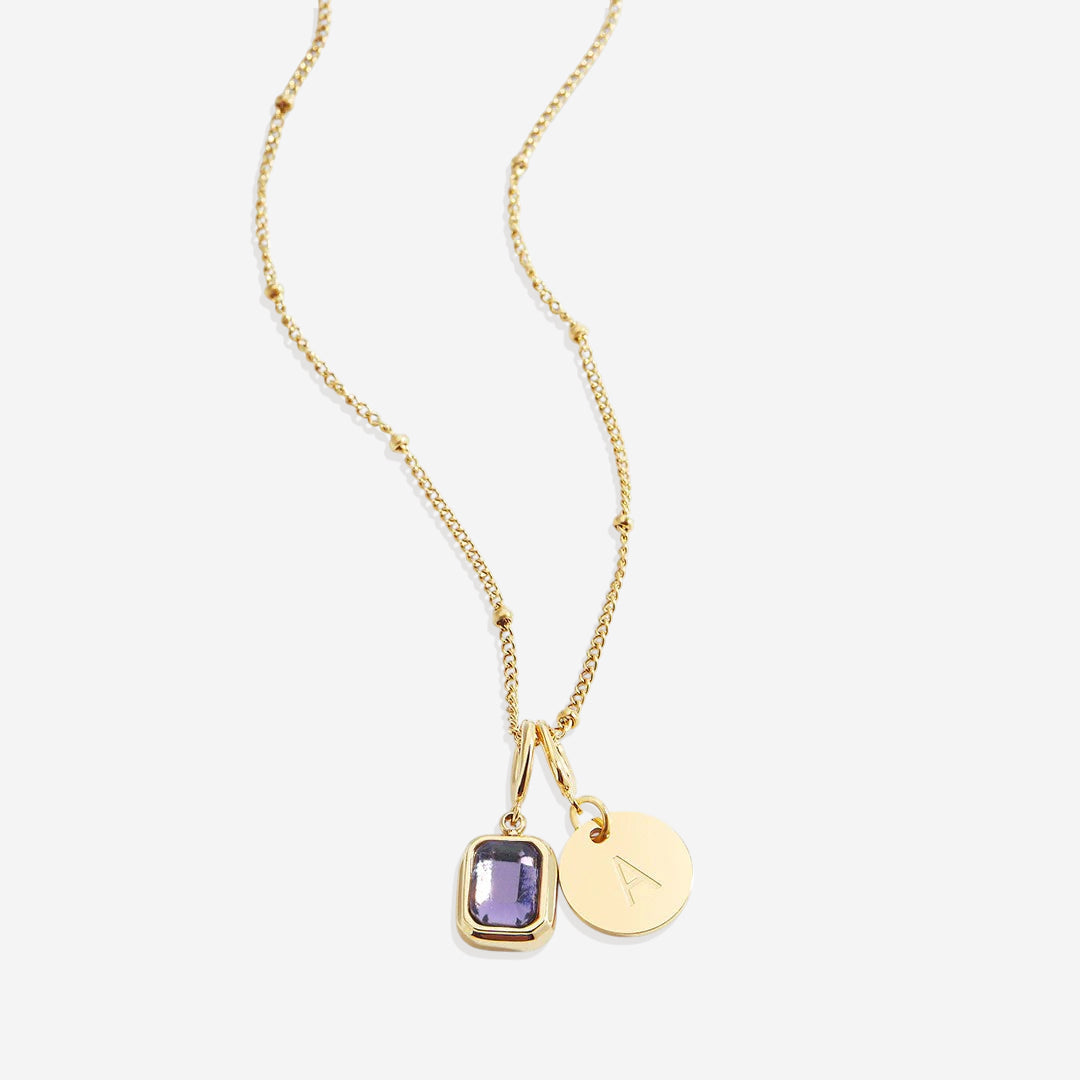 Collana con baguette, pietra portafortuna e iniziale