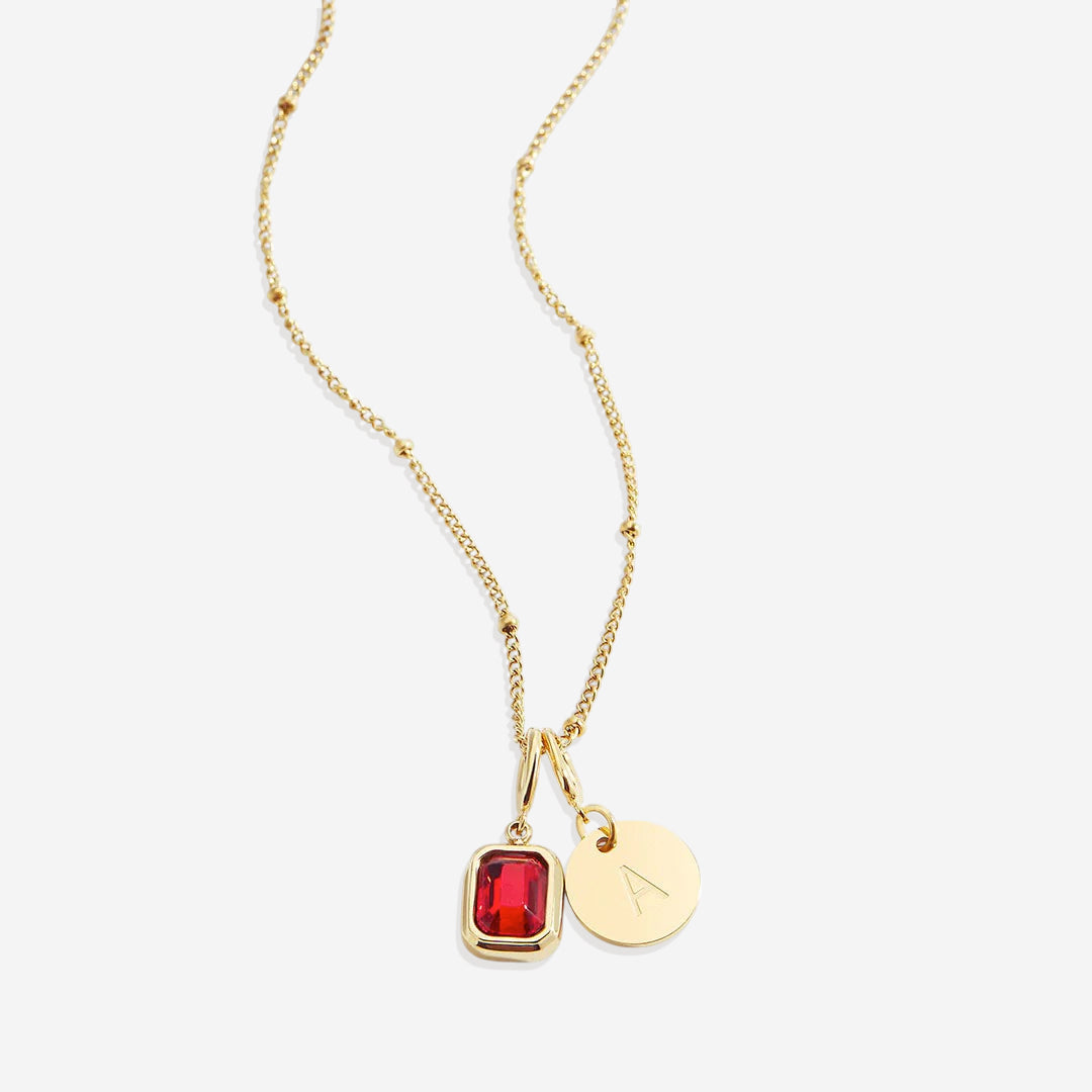Collana con baguette, pietra portafortuna e iniziale