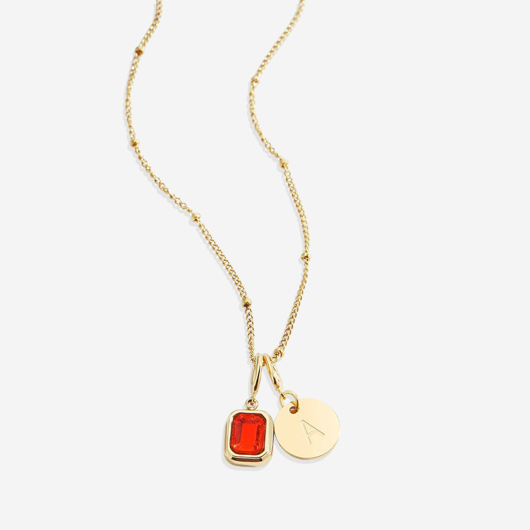 Collana con baguette, pietra portafortuna e iniziale