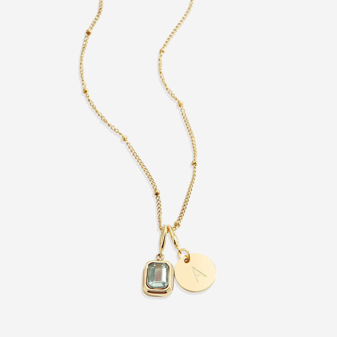 Collana con baguette, pietra portafortuna e iniziale