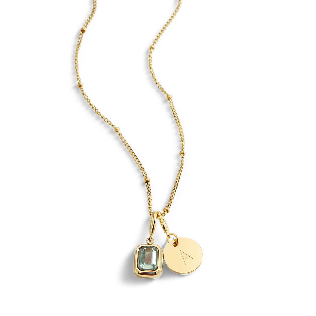 Collana con baguette, pietra portafortuna e iniziale