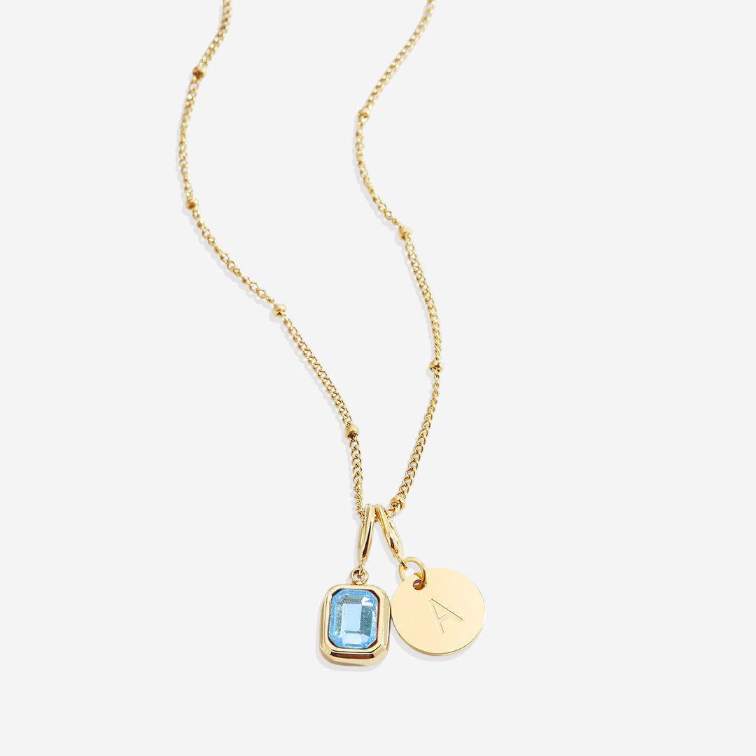 Collana con baguette, pietra portafortuna e iniziale