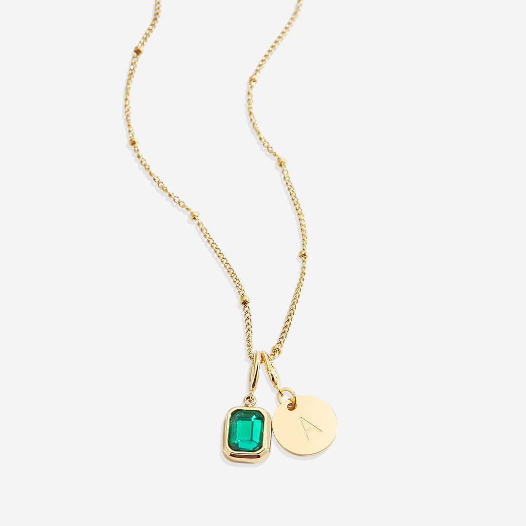 Collana con baguette, pietra portafortuna e iniziale