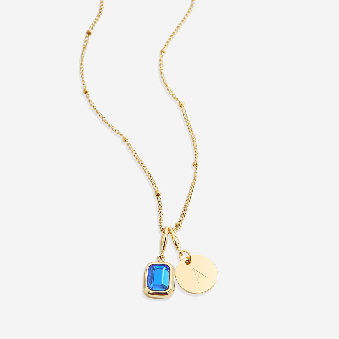 Collana con baguette, pietra portafortuna e iniziale