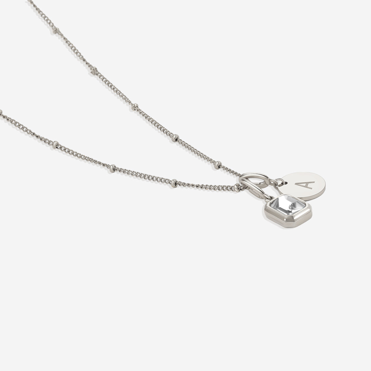Collana con baguette, pietra portafortuna e iniziale
