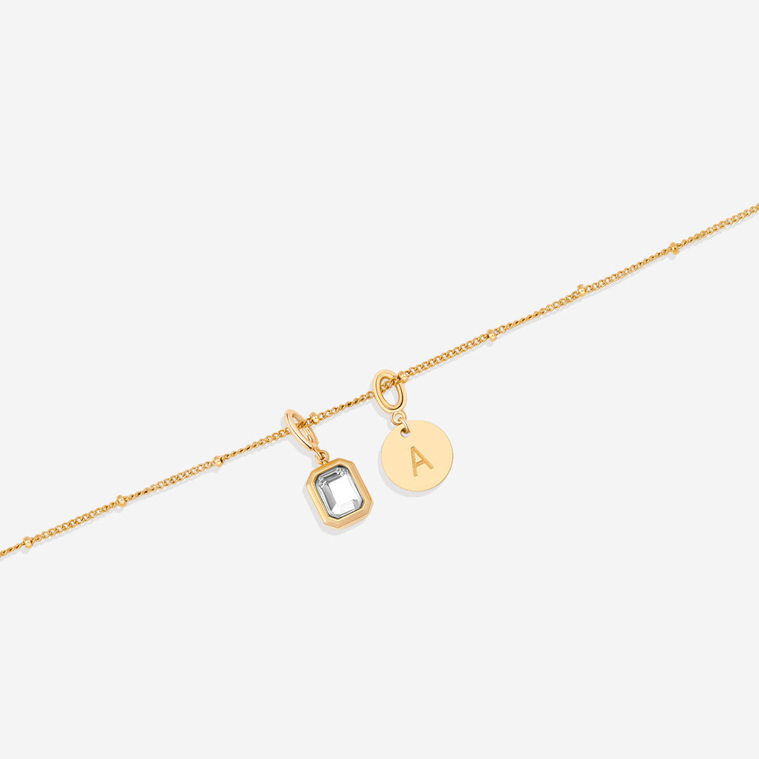 Collana con baguette, pietra portafortuna e iniziale