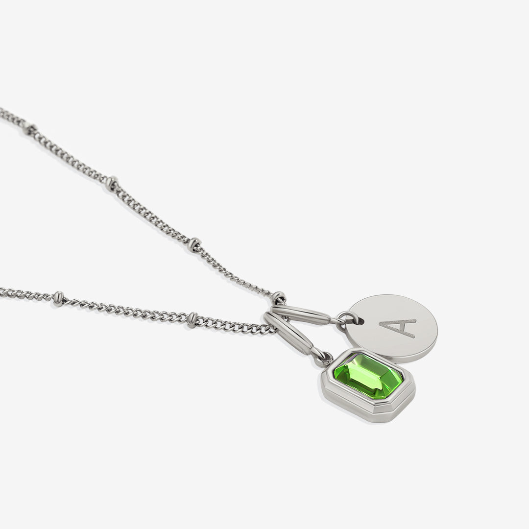 Collana con baguette, pietra portafortuna e iniziale