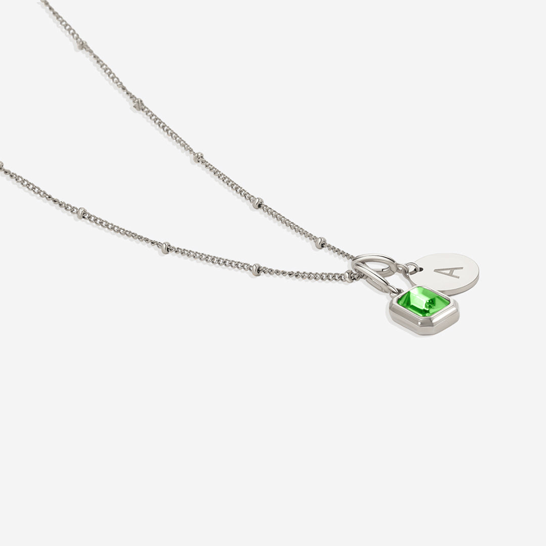 Collana con baguette, pietra portafortuna e iniziale