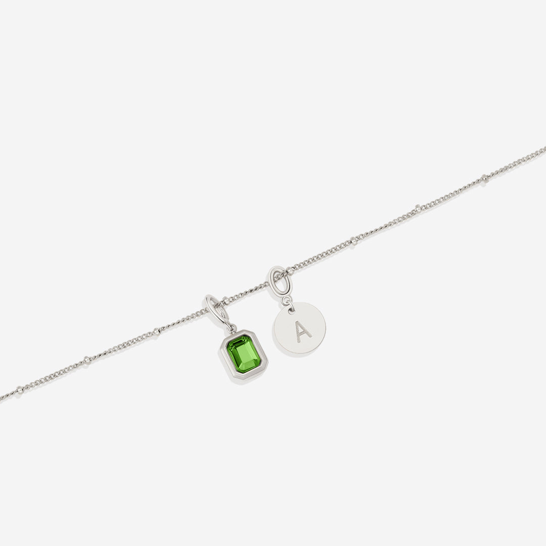 Collana con baguette, pietra portafortuna e iniziale