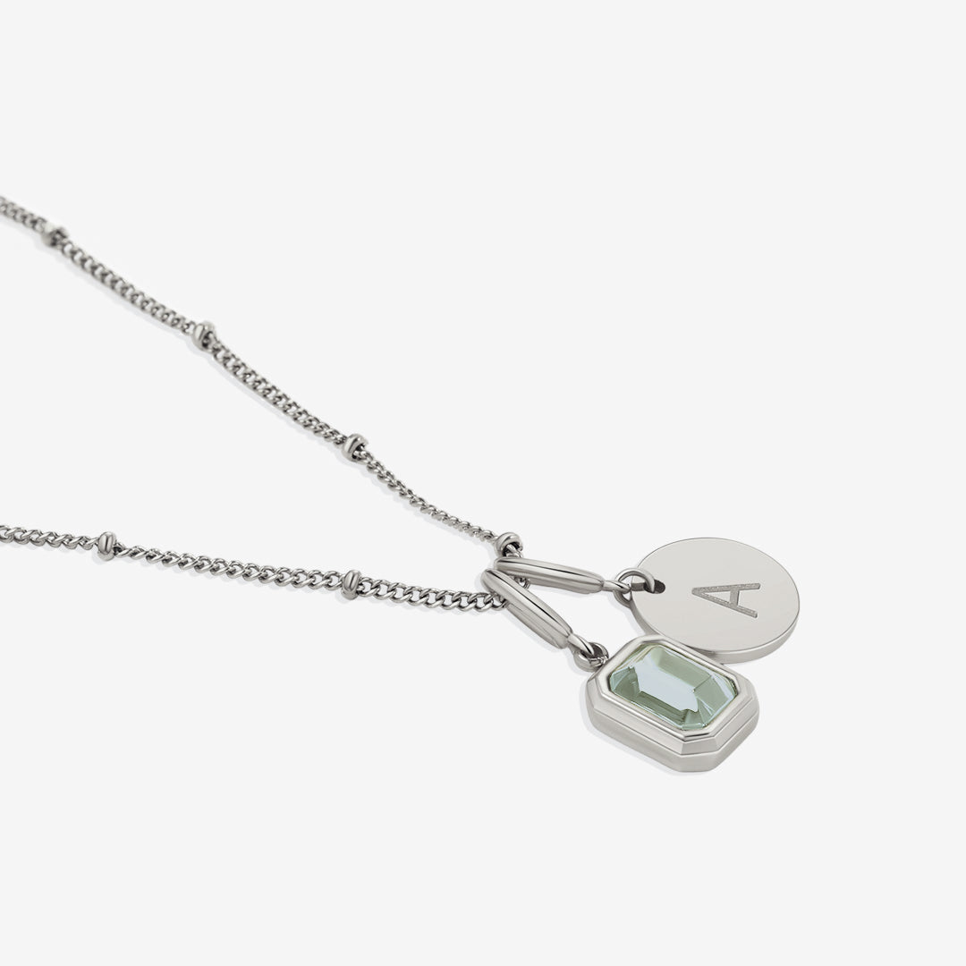 Collana con baguette, pietra portafortuna e iniziale
