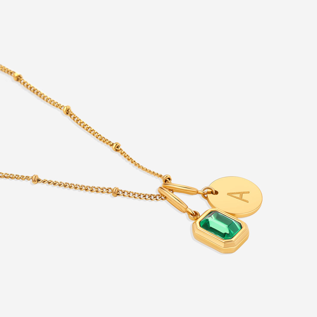 Collana con baguette, pietra portafortuna e iniziale