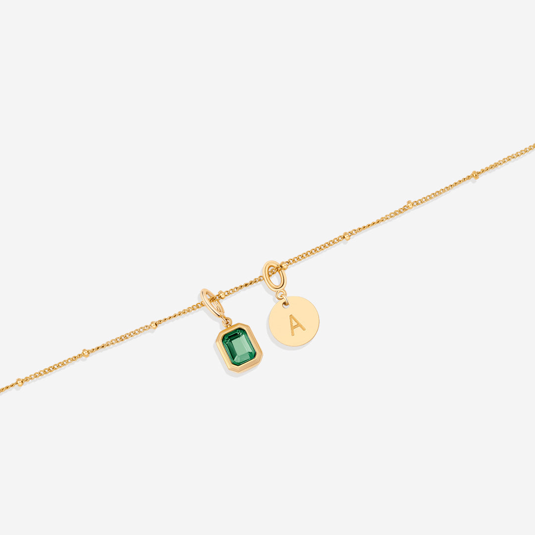 Collana con baguette, pietra portafortuna e iniziale