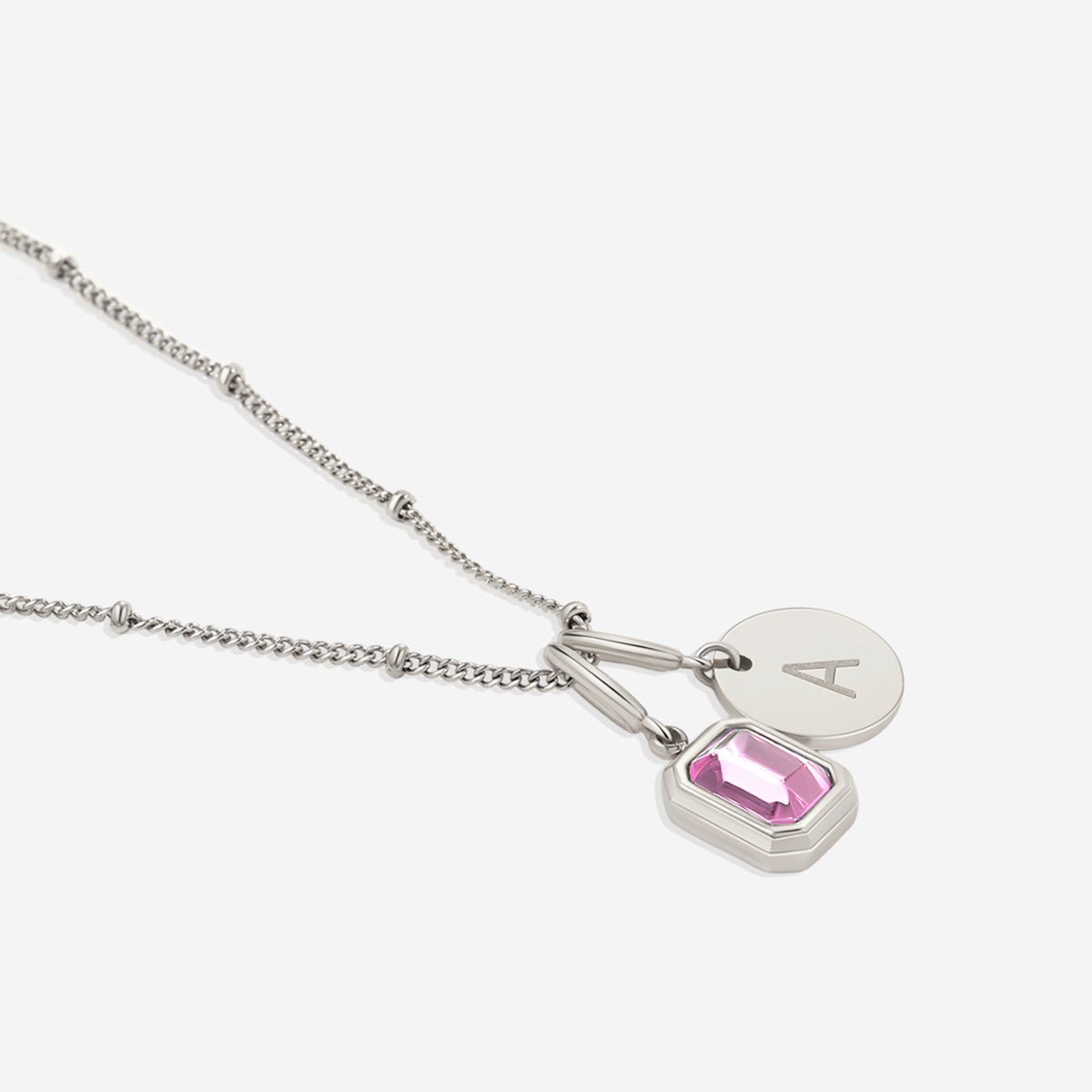 Collana con baguette, pietra portafortuna e iniziale