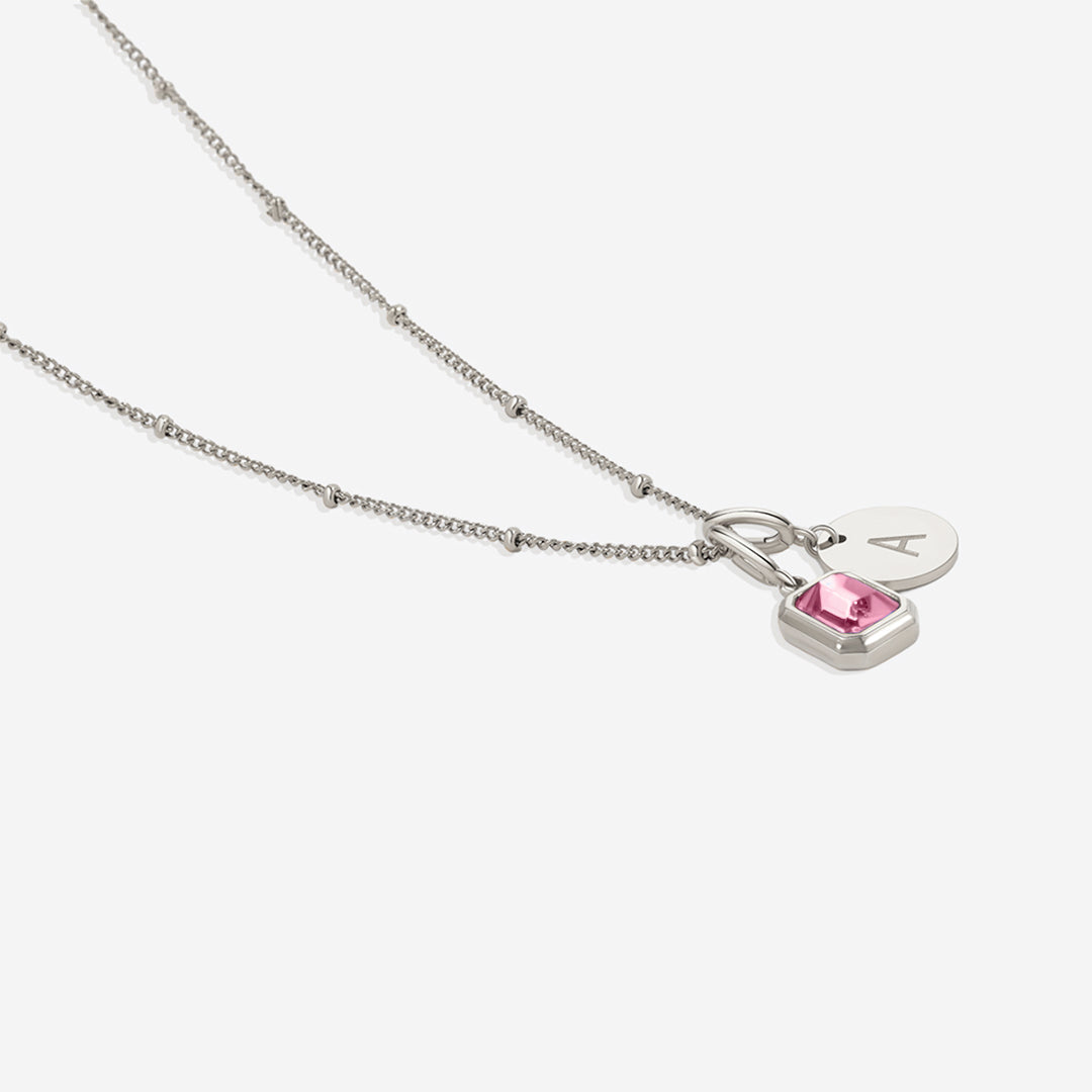 Collana con baguette, pietra portafortuna e iniziale