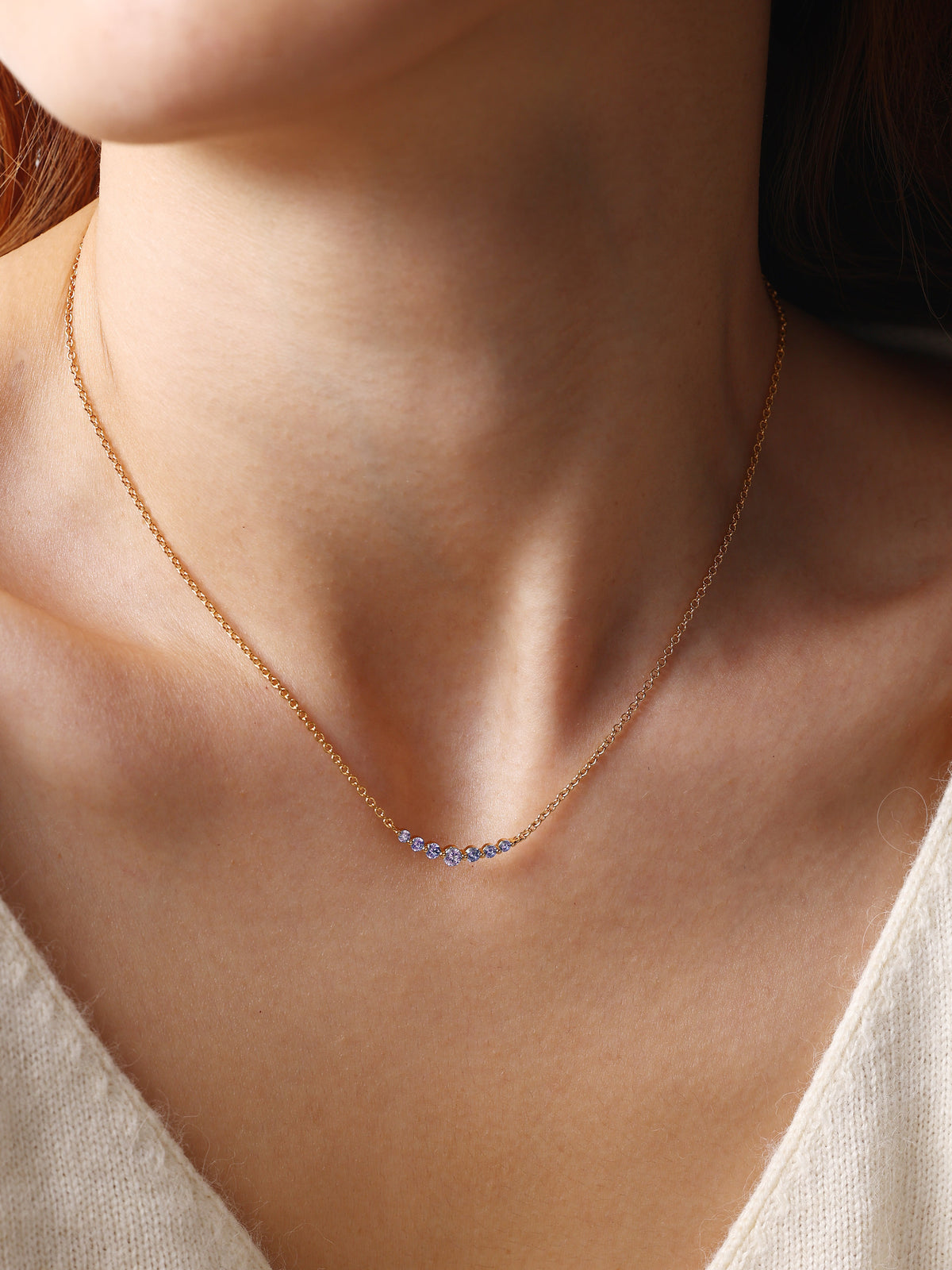Birthstone Arc Necklace with June birthstone, worn on a model