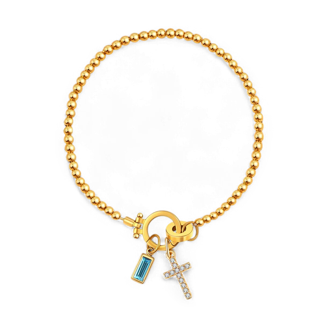 Cross Charm Birthstone Bracelet in gold tone with December birthstone