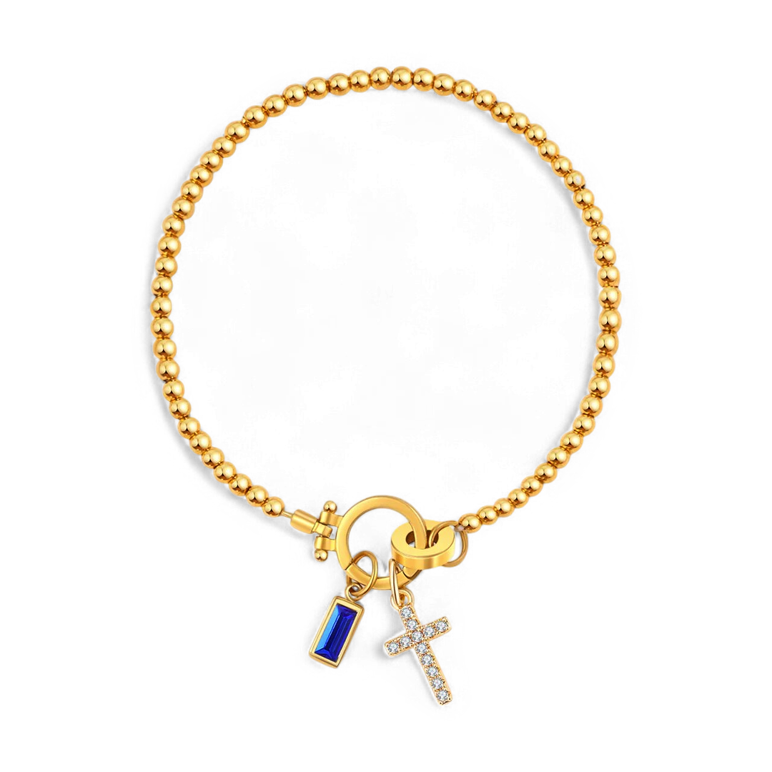 Cross Charm Birthstone Bracelet in gold tone with September birthstone