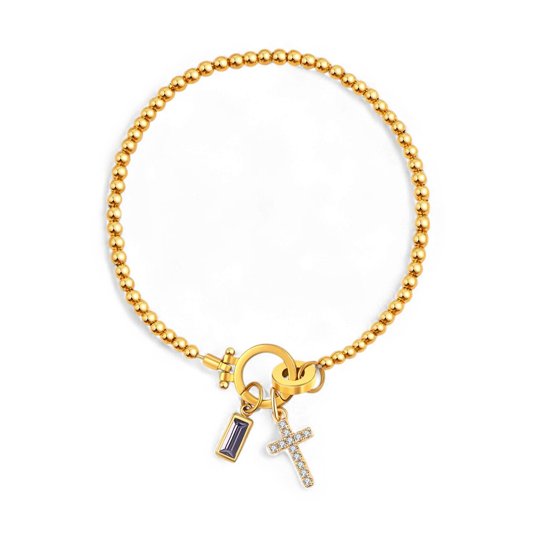 Cross Charm Birthstone Bracelet in gold tone with February birthstone