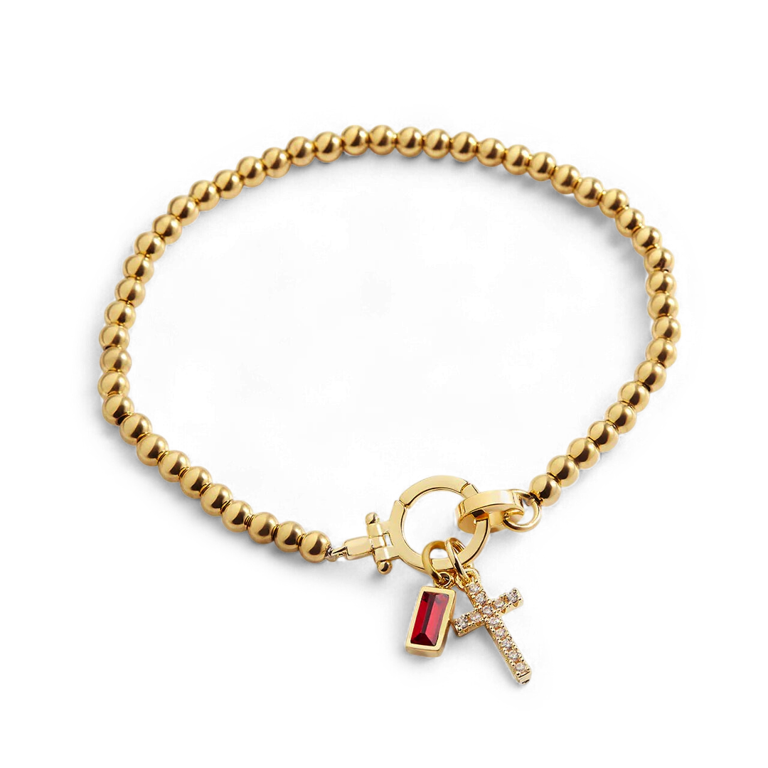 Cross Charm Birthstone Bracelet in gold tone with January birthstone