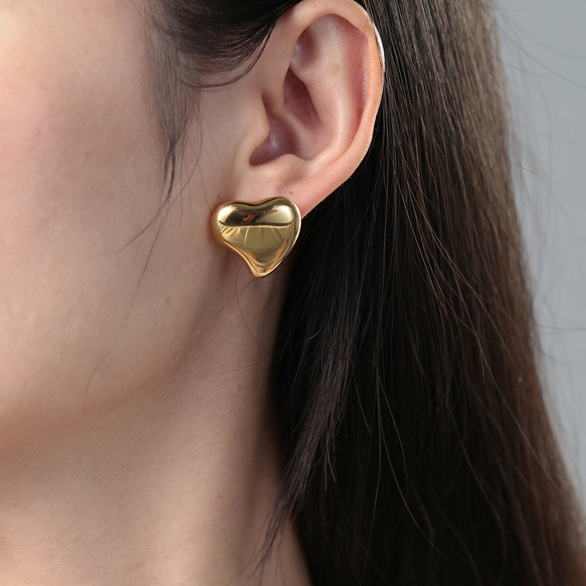 Polished Sculptural Heart Earrings in gold tone