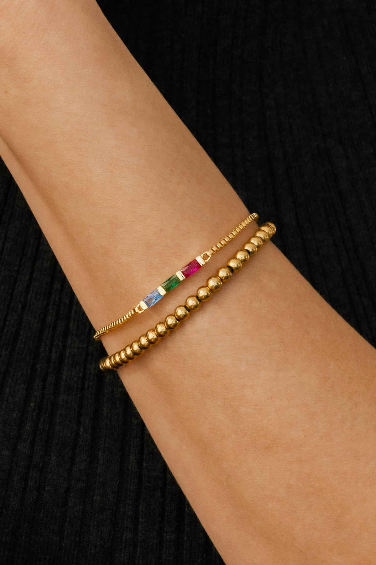 Dainty Baguette Birthstone Bracelet and Beaded Stacking Bracelet Set, worn on a model