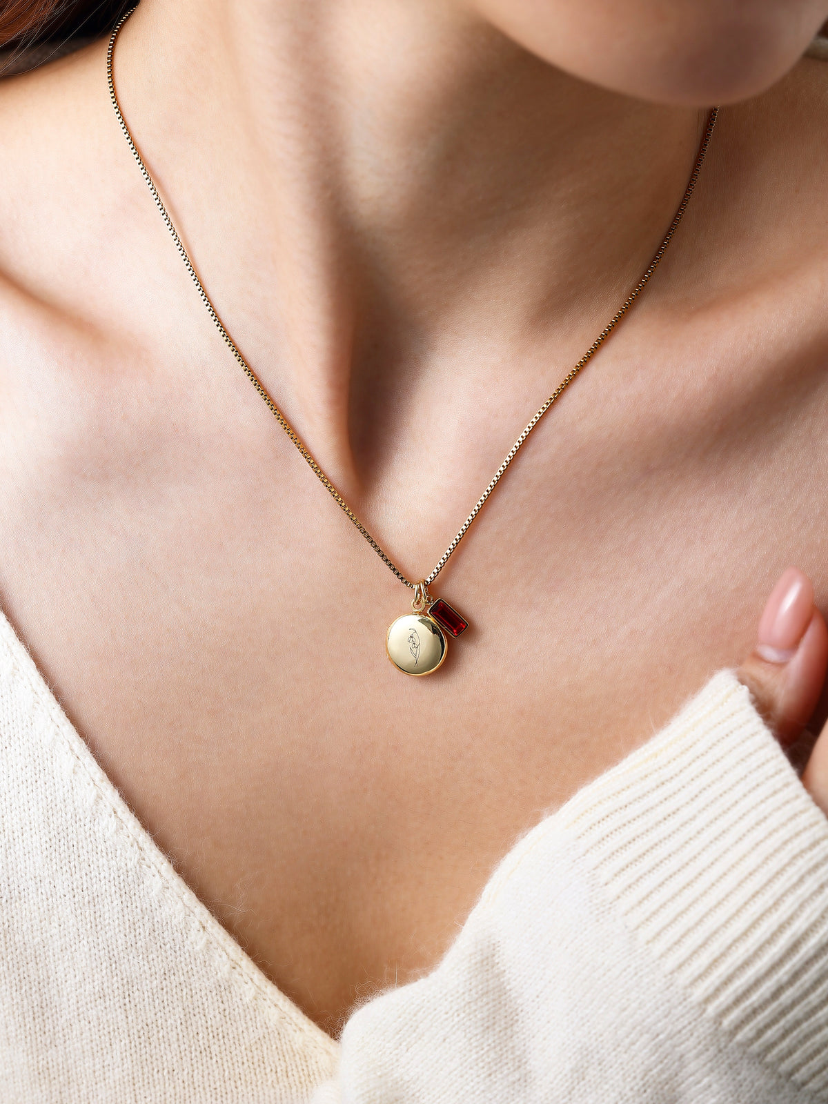 Family Birth Flower Locket Necklace with Birthstone with January birthstone, worn on a model
