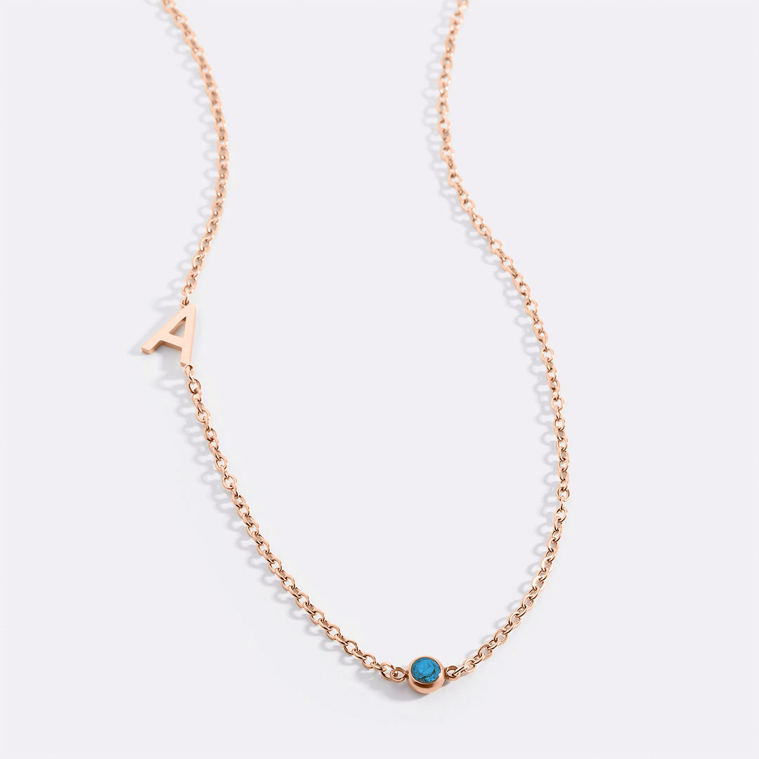 Initial Necklace with Birthstone Accent in rose gold tone with December birthstone