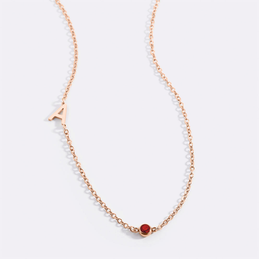 Initial Necklace with Birthstone Accent in rose gold tone with January birthstone
