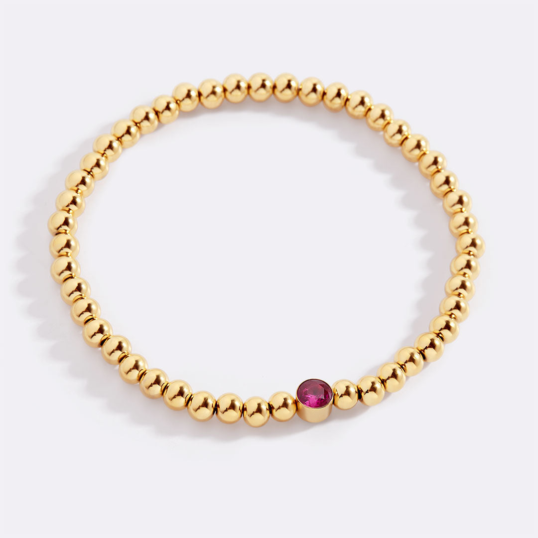 Gold Beaded Bubble Birthstone Bracelet in gold tone with July birthstone