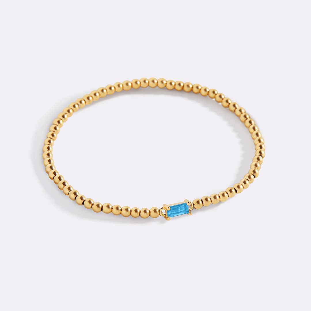 Gold Beaded Birthstone Bracelet in gold tone with December birthstone
