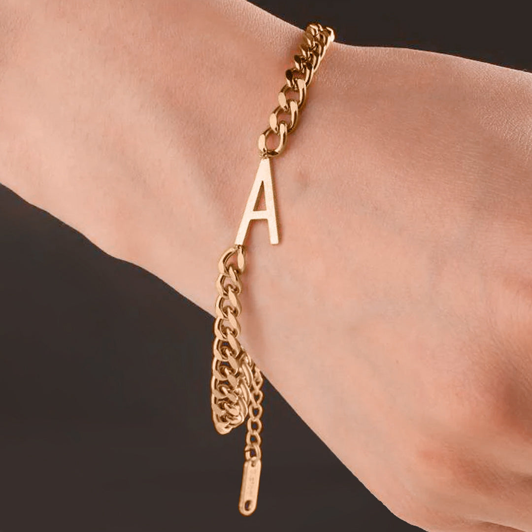 The Skinny Initial Bracelet in rose gold tone, worn on a model