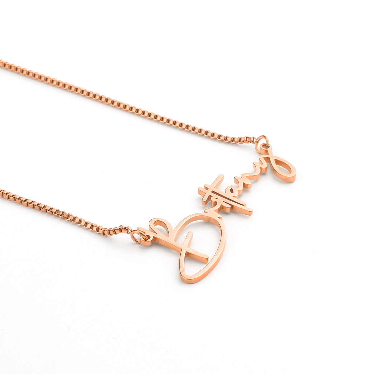 Modern Name Necklace in rose gold tone, flat lay detail
