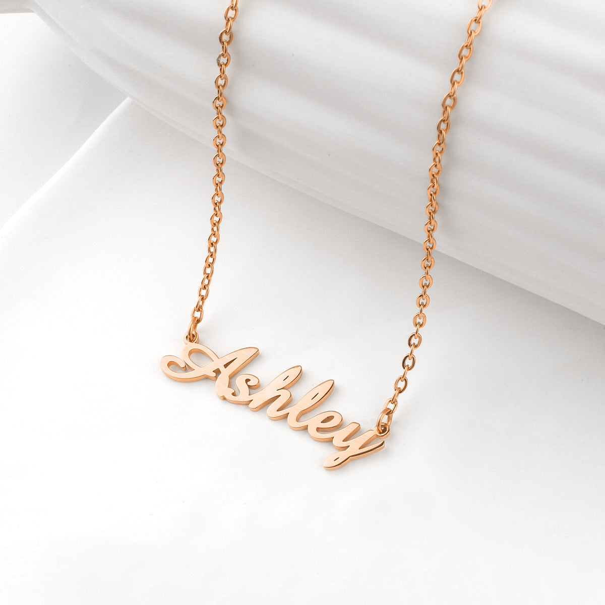 Quill Name Necklace in rose gold tone, flat lay detail