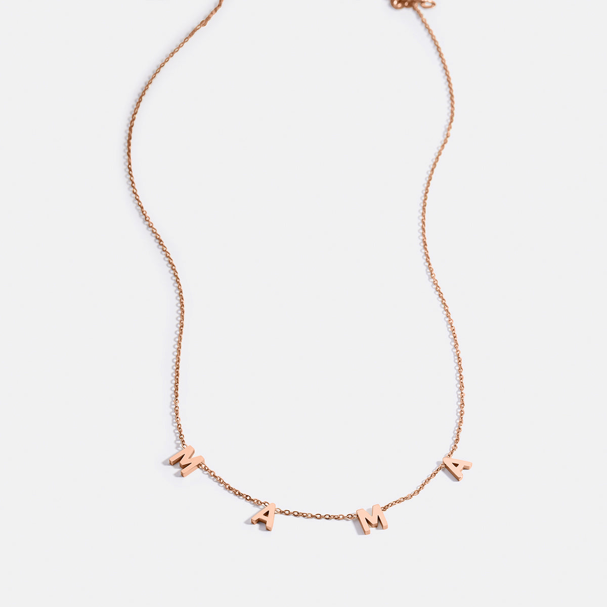 The MAMA Letter Necklace in rose gold tone