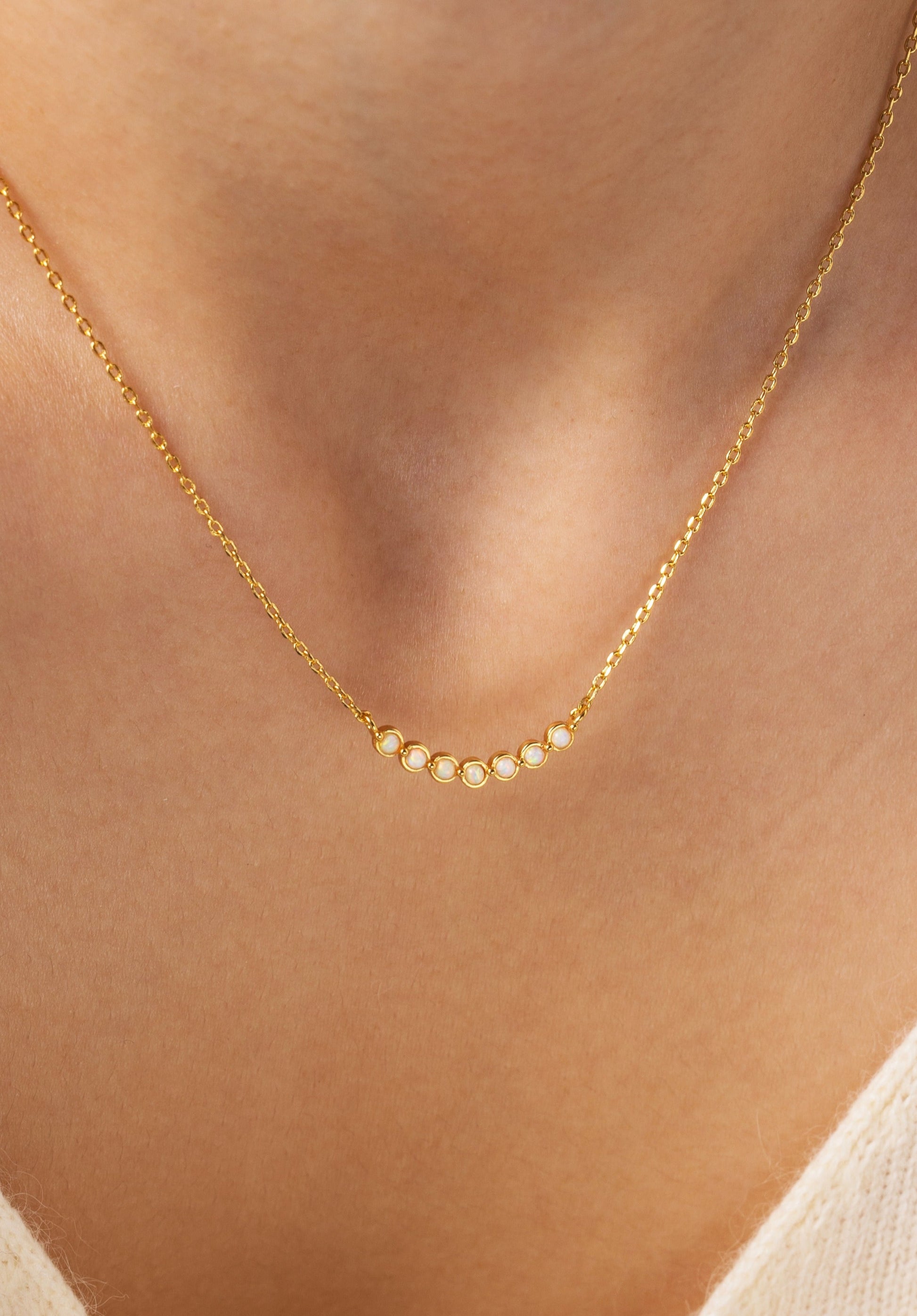 Opal Arc Necklace, worn on a model