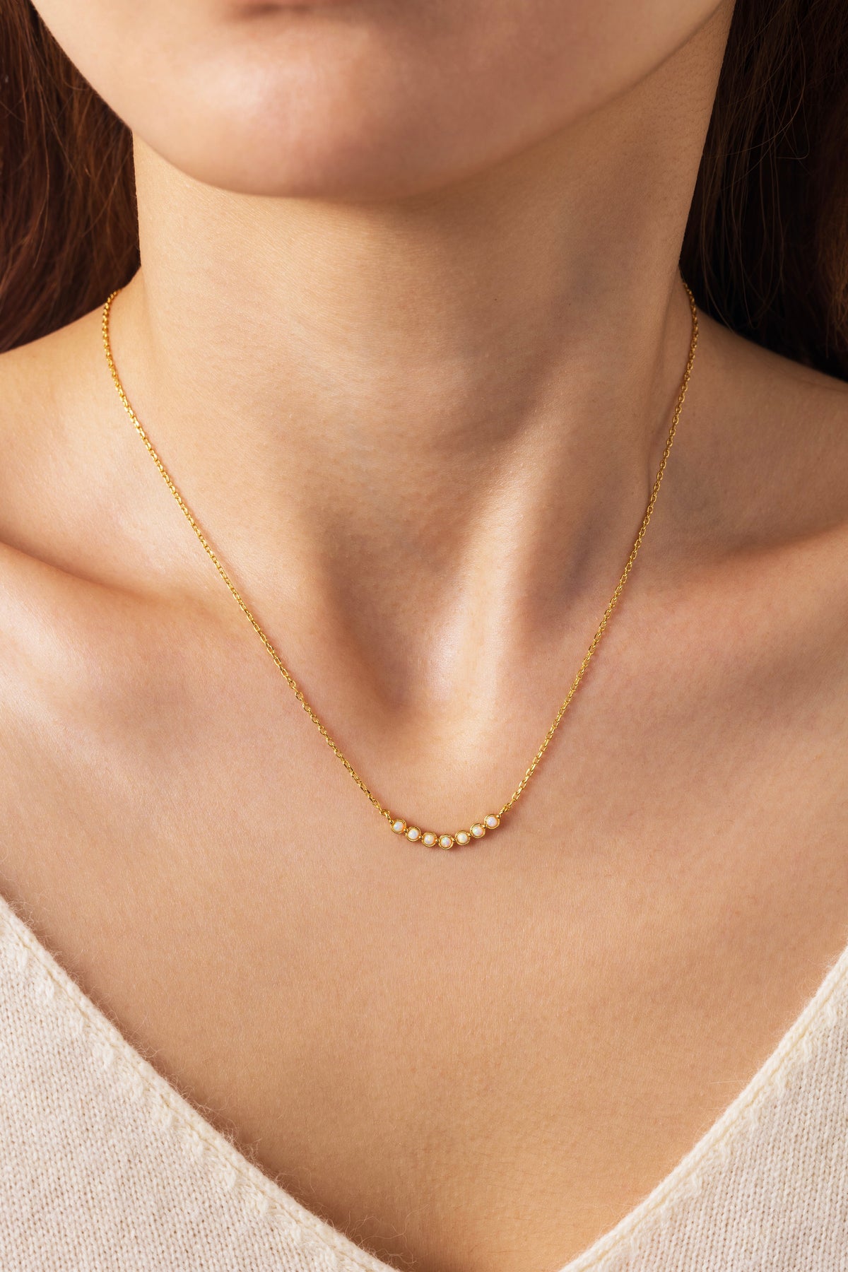 Opal Arc Necklace, worn on a model