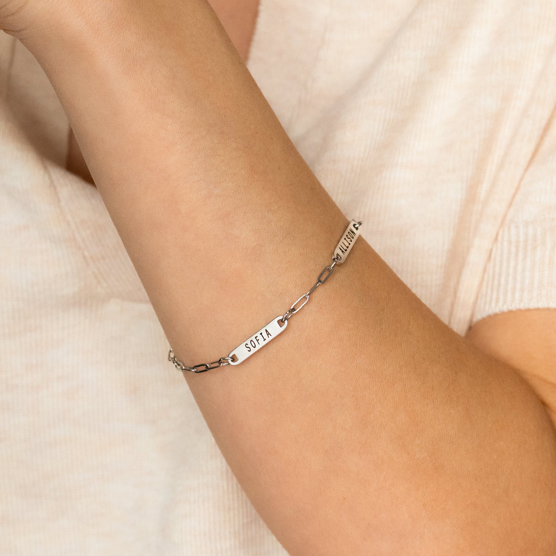 Personalized Paperclip Name Bracelet in 925 sterling silver, worn on a model