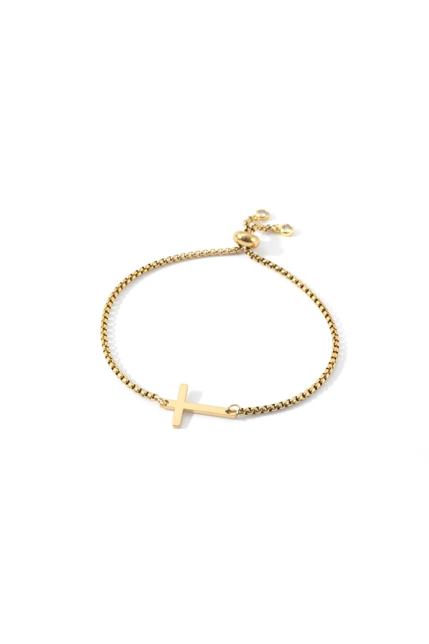 Sideways Cross Slider Bracelet in gold tone, flat lay detail