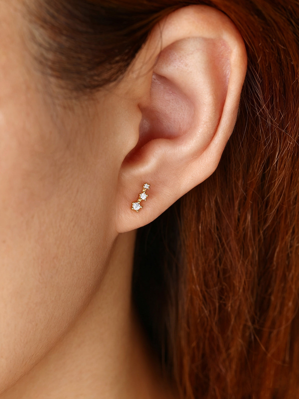 Sparkling Mini Climber Studs, worn on a model