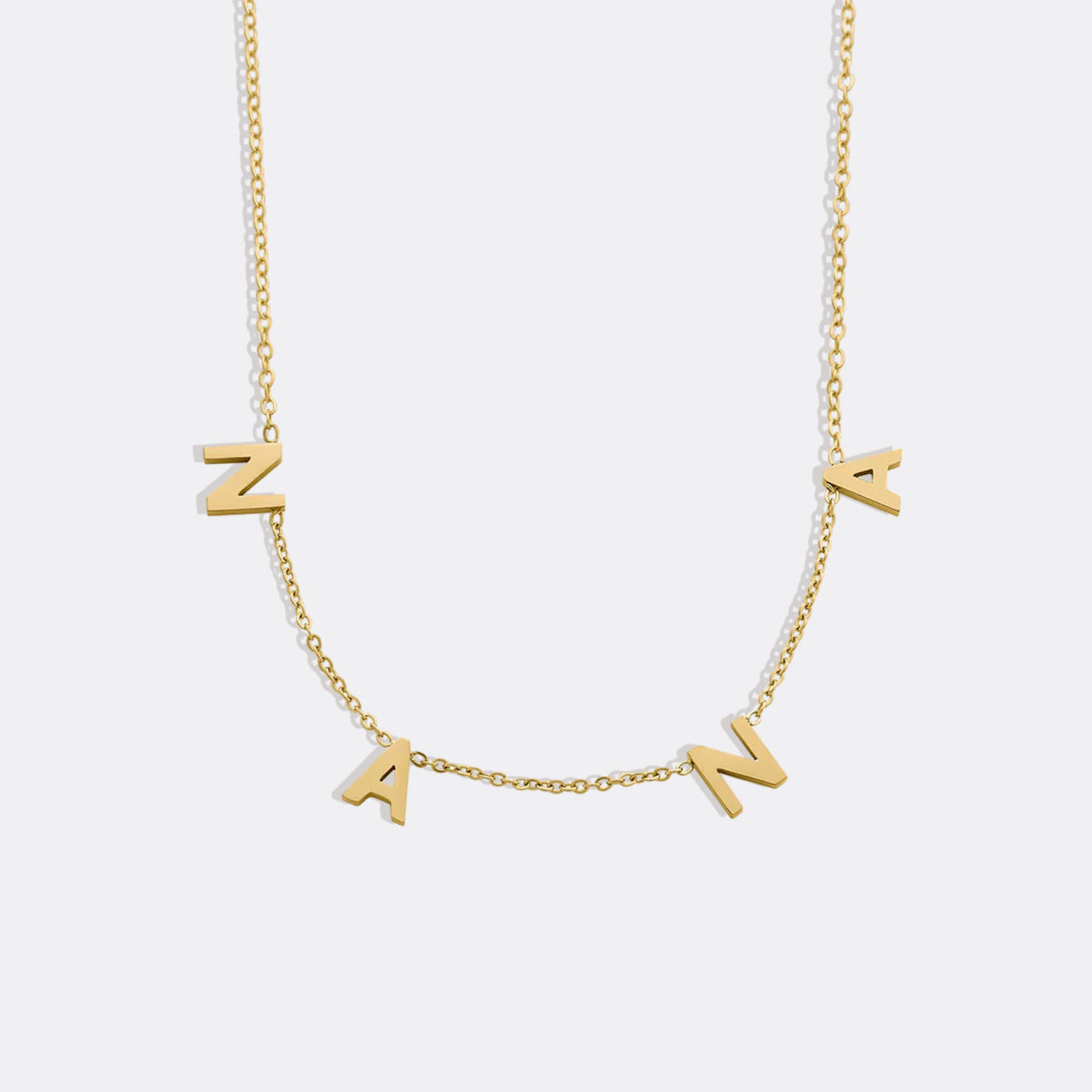 The NANA Letter Necklace in gold tone