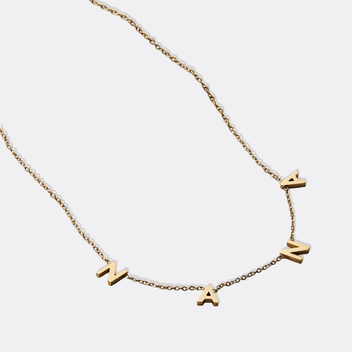 The NANA Letter Necklace in gold tone