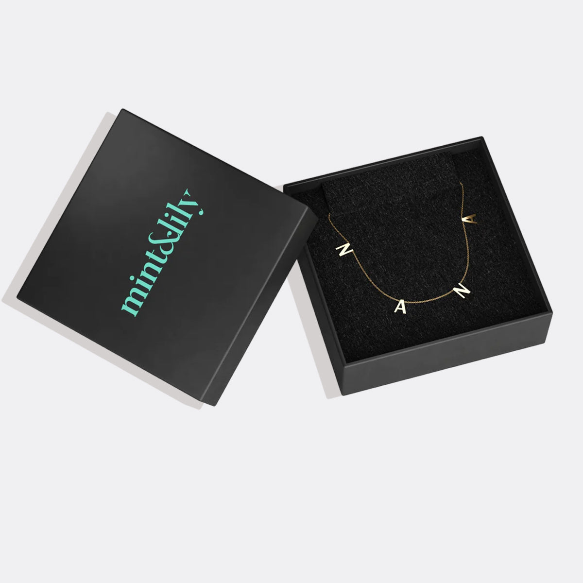 The NANA Letter Necklace in gold tone